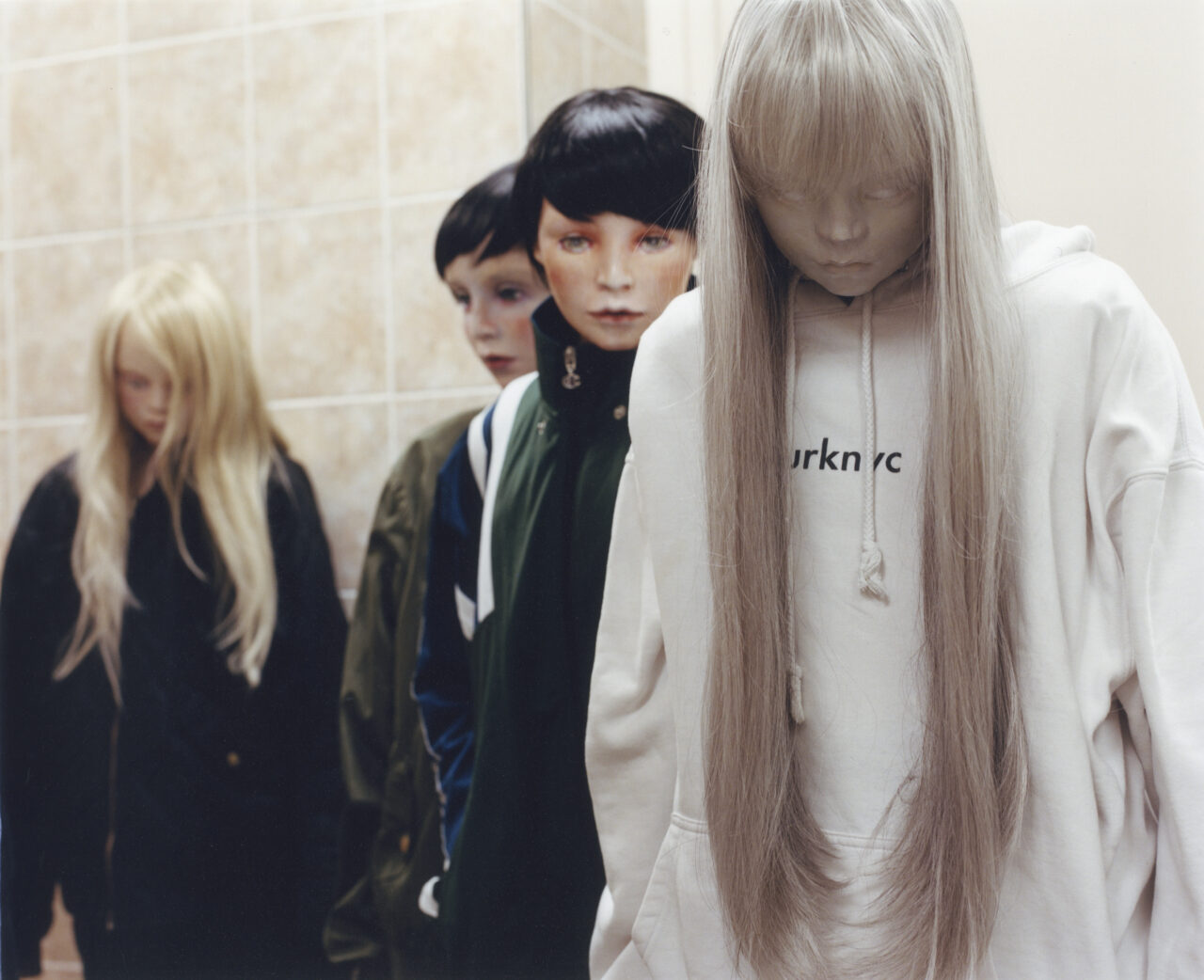 a group of four teenage puppets, wearing streatwear in an undefined place